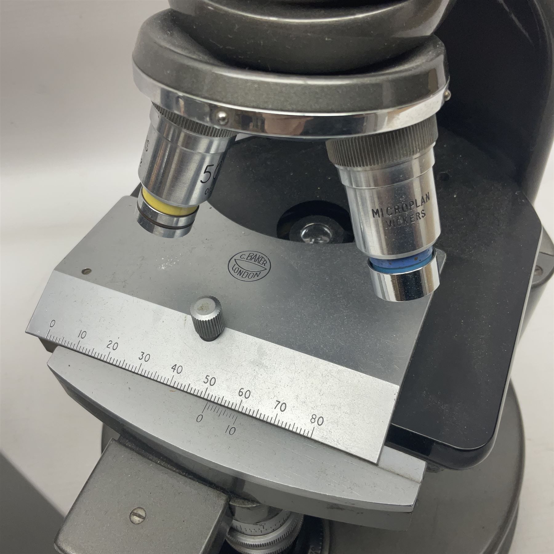 Four microscopes, comprising C Baker London Vickers, Back Diamax no 40956, Opax ABF no 232733 and one other 
