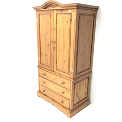 Solid pine wardrobe, shaped projecting cornice, two doors above three drawers, plinth base, W104cm, H193cm, D61cm 