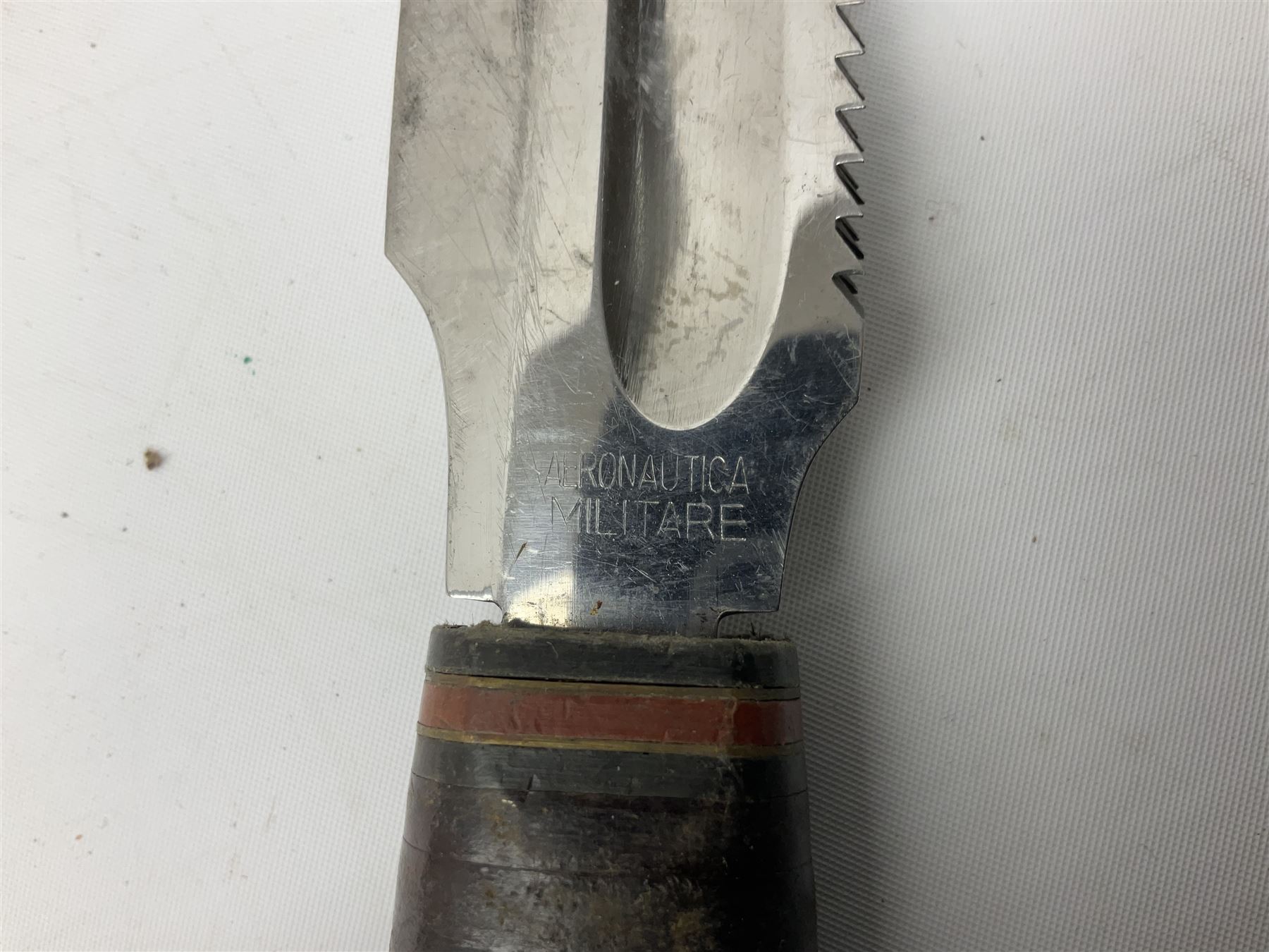 German ERN Wald-Solingen Art Deco style hunting knife with 13cm Bowie type blade and chrome fittings with antler grip; in leather sheath L24.5cm overall; and Bianchi Rastignano Aeronautica Militare combat knife with 15.5cm Bowie type saw-back blade and stacked leather grip (2)