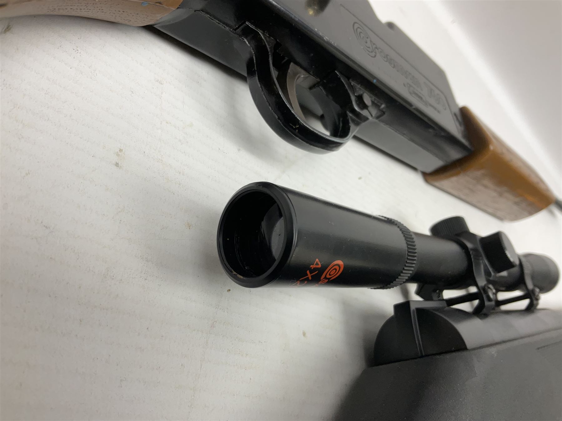 Crosman 760 .177 cal. Junior air rifle with under lever faux pump action and simulated wooden fittings; serial no.278047476, L90cm overall; and SMK B1 Synthetic .22 cal. Youth's air rifle with break-barrel action and 4 x 20 scope; serial no.1721229956084915F, L98.5cm overall (2)  NB: AGE RESTRICTIONS APPLY TO THE PURCHASE OF AIR WEAPONS.