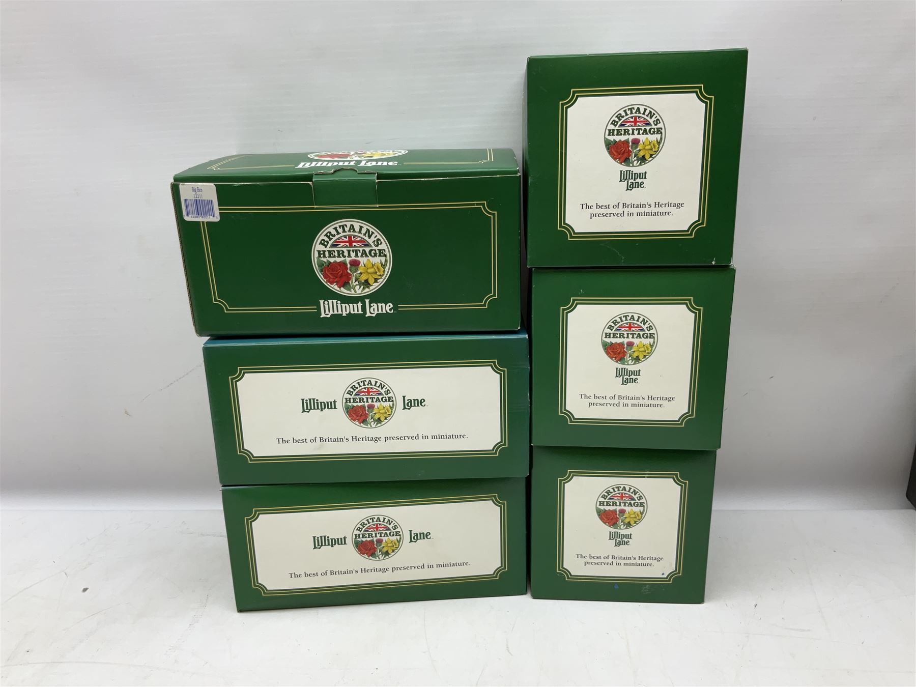 Six Lilliput Lane models from the 'Britain's Heritage' collection, comprising Hampton Court Palace, Tower Bridge, Tower of London, Buckingham Palace, Marble Arch and Big Ben, all boxed