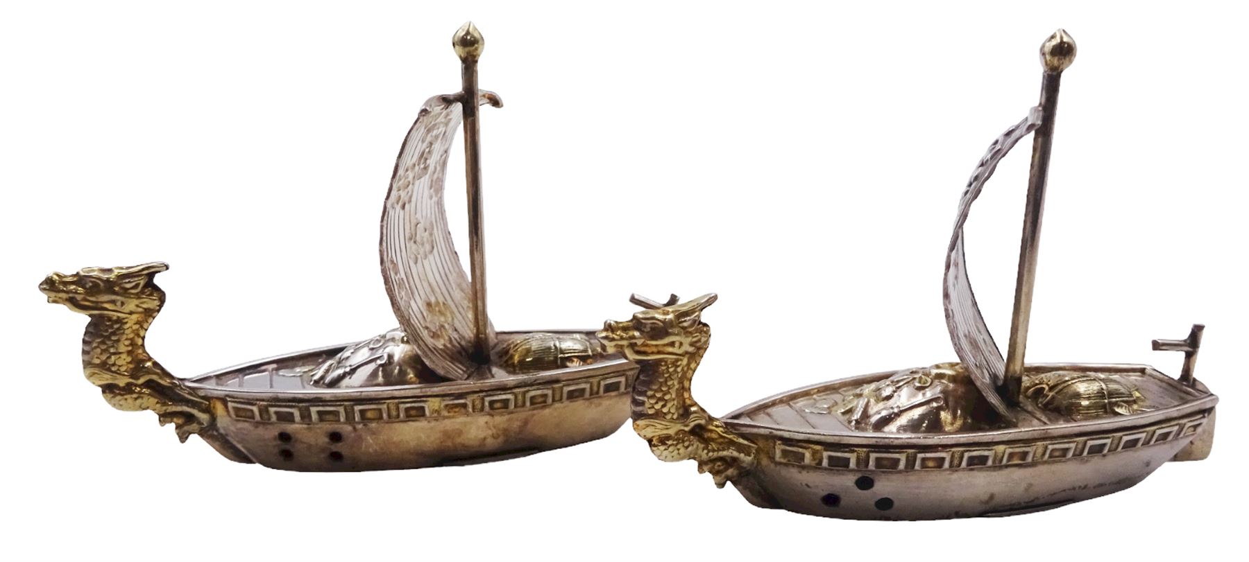 Pair of 20th century Japanese silver novelty cruets, modelled in the form of Viking long ships, marked Sterling Japan, contained within a fitted case, approximate silver weight 1.18 ozt (36.6 grams)