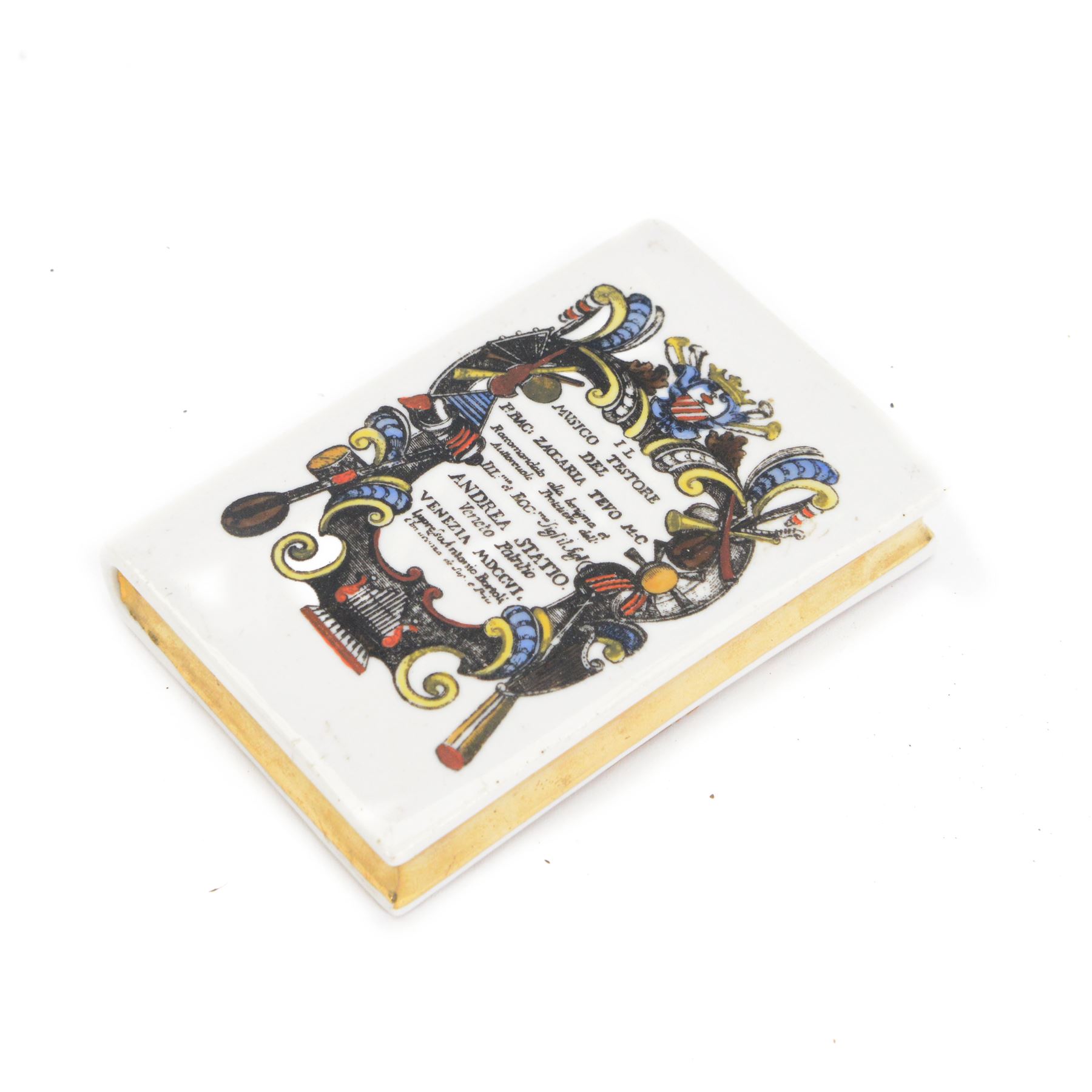 Fornasetti paperweight modelled as a book, titled to the spine IL Mvsico Testore, green felt back with printed mark, L11cm