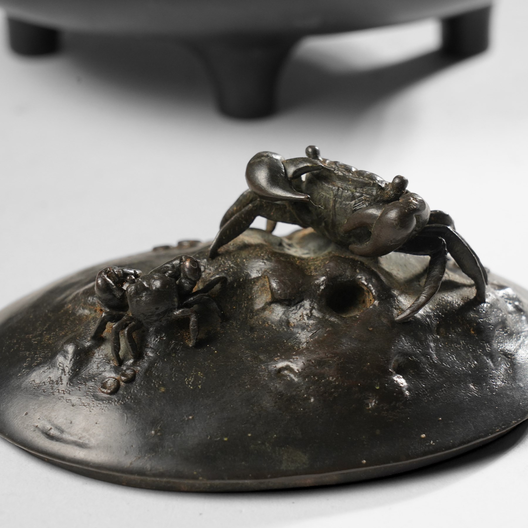 Japanese Meiji period covered vessel, the cover formed with two crabs and the surround decorated with fish, character signature to base, H12cm