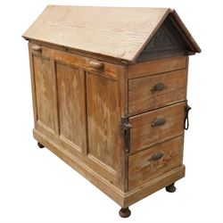 Musgrave & Co Ltd (Belfast) - late 19th century pine saddle horse, with three drawers to one end and cupboard door to the other, the hinged top opening to form a table, the cast iron plaque bears the Royal coat of arms and maker's name