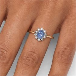 18ct gold sapphire and diamond cluster ring, oval cut sapphire of approx 1.50 carat, surrounded by ten round brilliant cut diamonds, Birmingham import mark 1981, total diamond weight approx 0.30 carat