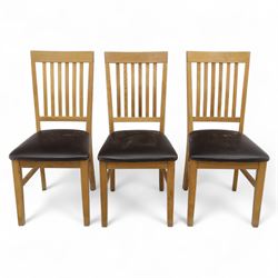 Contemporary set of six light oak dining chairs with faux leather cushion seats 