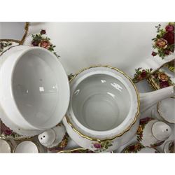 Royal Albert Country Roses pattern part tea and dinner service, to include teapot, four cups and saucers, four dessert plates, cake plate etc, (41)
