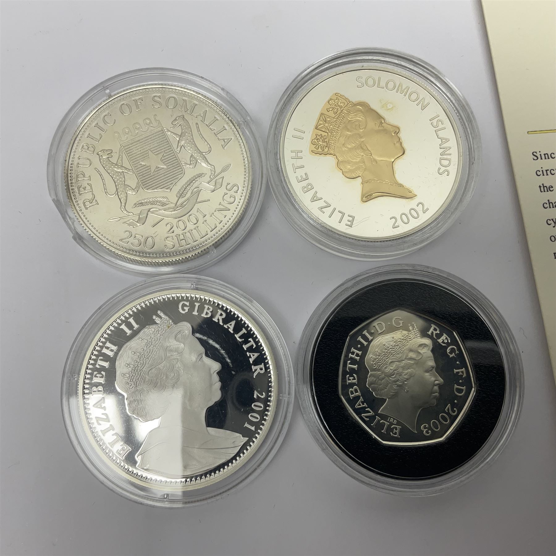 Thirteen silver coins, including Queen Elizabeth II Solomon Islands 2002 sterling silver five dollars, Alderney 2002 sterling silver five pounds, Fiji 2002 sterling silver ten dollars, United Kingdom 2003 one ounce fine silver Britannia, 2003 'Give Women The Vote' fifty pence etc, all with some form of certificate