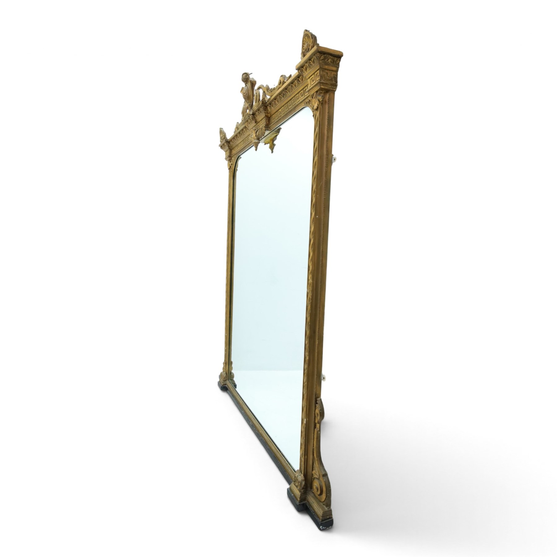 Large late 19th century gilt framed overmantel mirror, urn pediment above a foliate and Greek key frieze, egg and dart beaded edges, enclosing a plain mirror plate, with scrolled lower sections