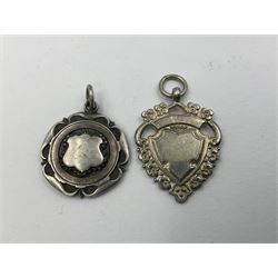 Ten early 20th century silver cartouche fobs, to include a Yorkshire Rose example, all hallmarked with various dates and makers
