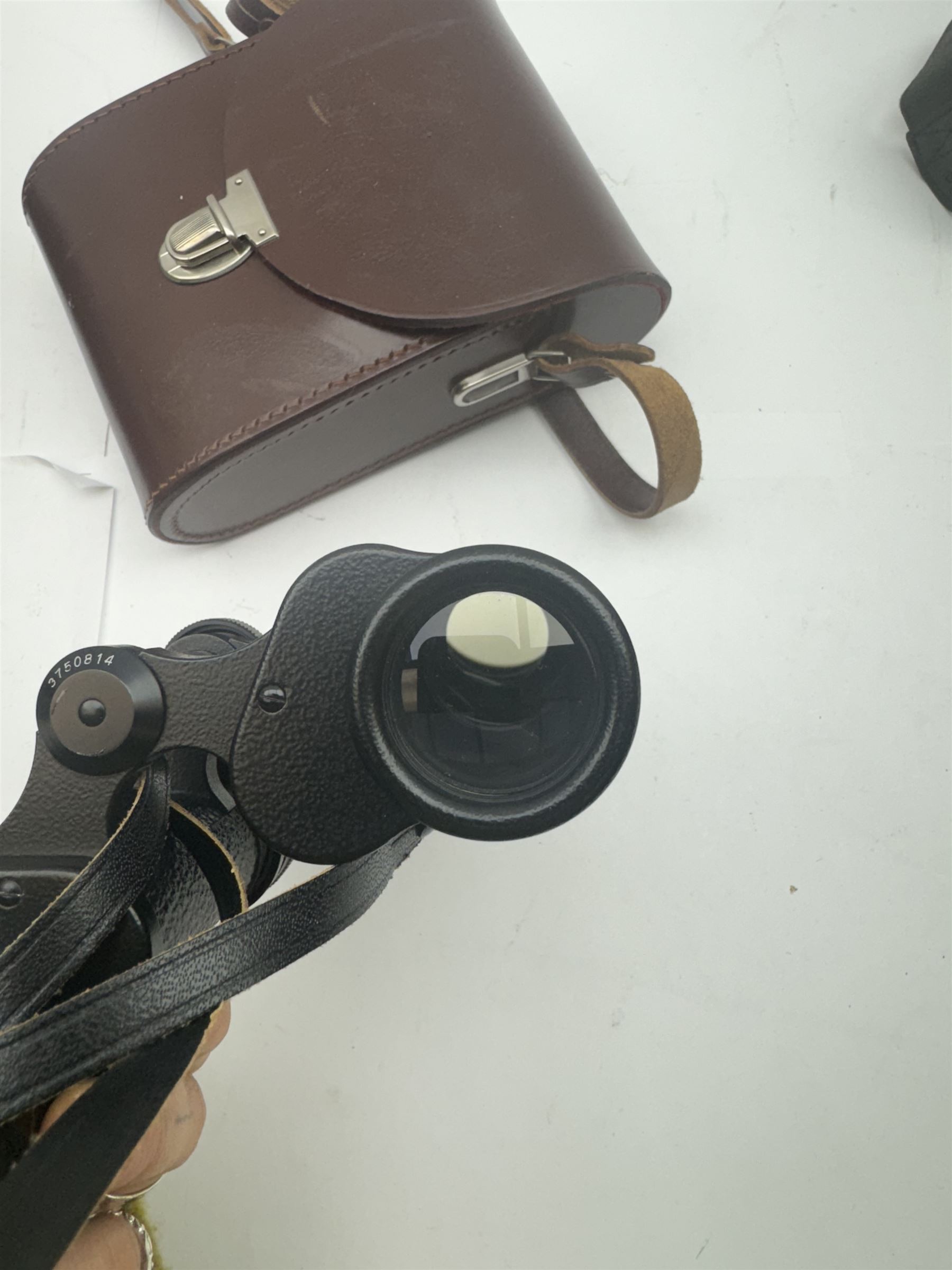 Four pairs of binoculars, to include Carl Zeiss Jena Jenoptem 8x30W serial no. 3750814, Nikon Sporting II 8x40 serial no. 604672, Minolta Pocket II 8x22 Field 7 and Jessops 12x25 Field 4.8 84m/1000m, all in carrying cases 