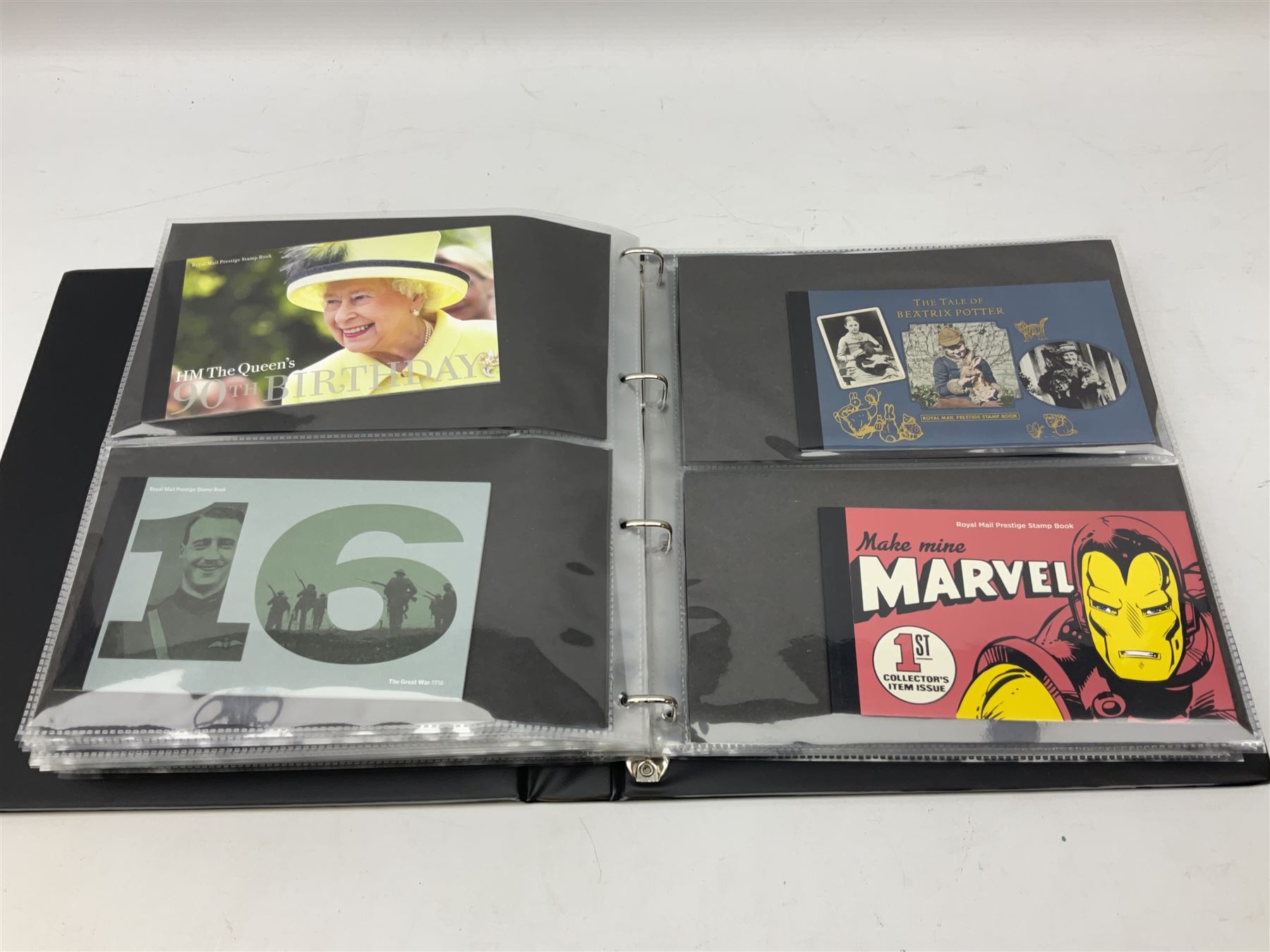 Seventy-five Royal Mail book of stamps, including 'The Story of Beatrix Potter', 'Microcosmos', 'Across The Universe', 'A Perfect Coronation', 'The Bronte Sisters', 'Battle of Trafalgar Death of Nelson' etc, housed in a ring binder album