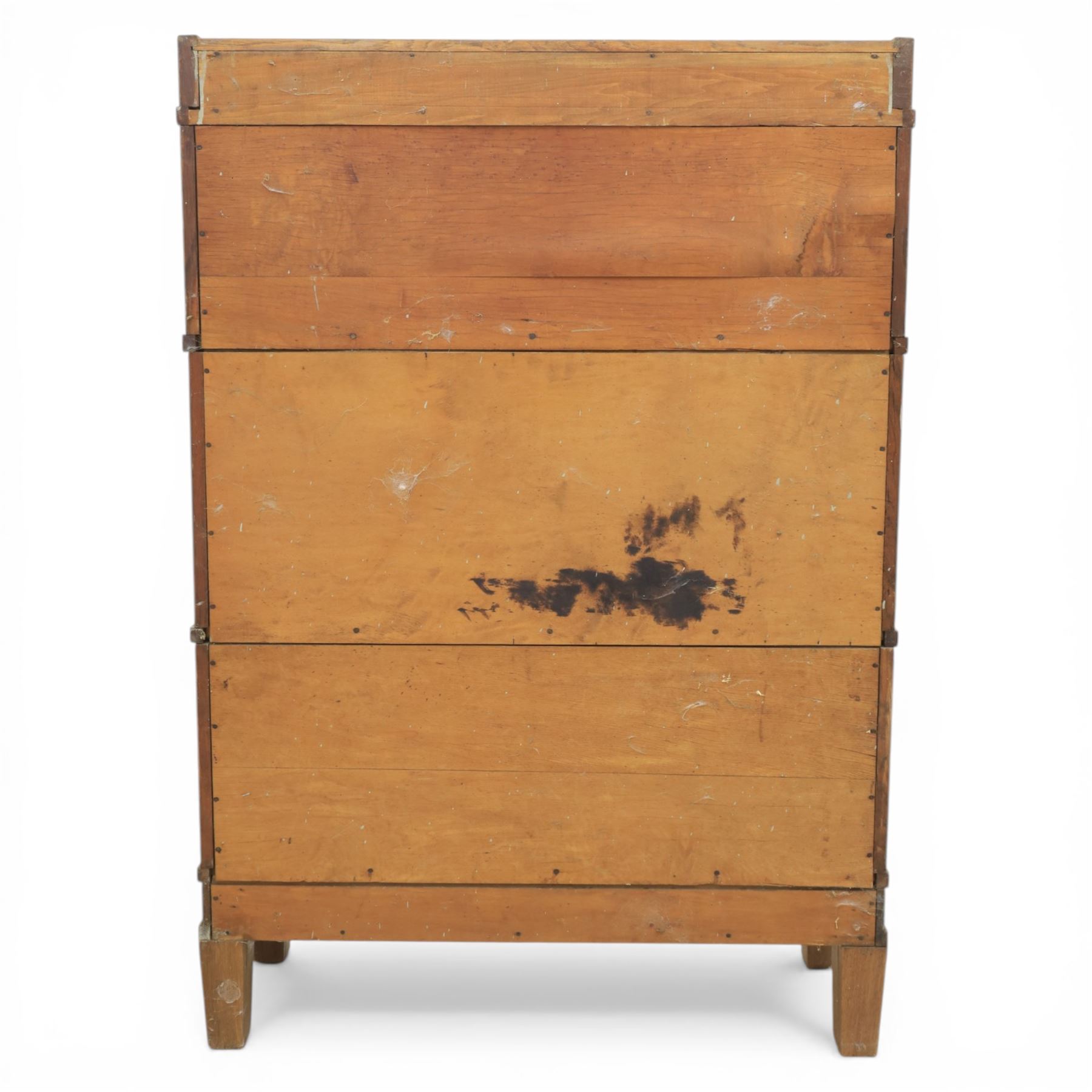 Globe Wernicke - Modular oak sectional bookcase, the three glazed up-and-over doors with panelled sides, raised on a plinth base with square supports