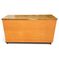 20th century haberdashery style chest, solid elm top over twenty-four assorted drawers with white ceramic knob handles, painted sage green carcass, raised on castors