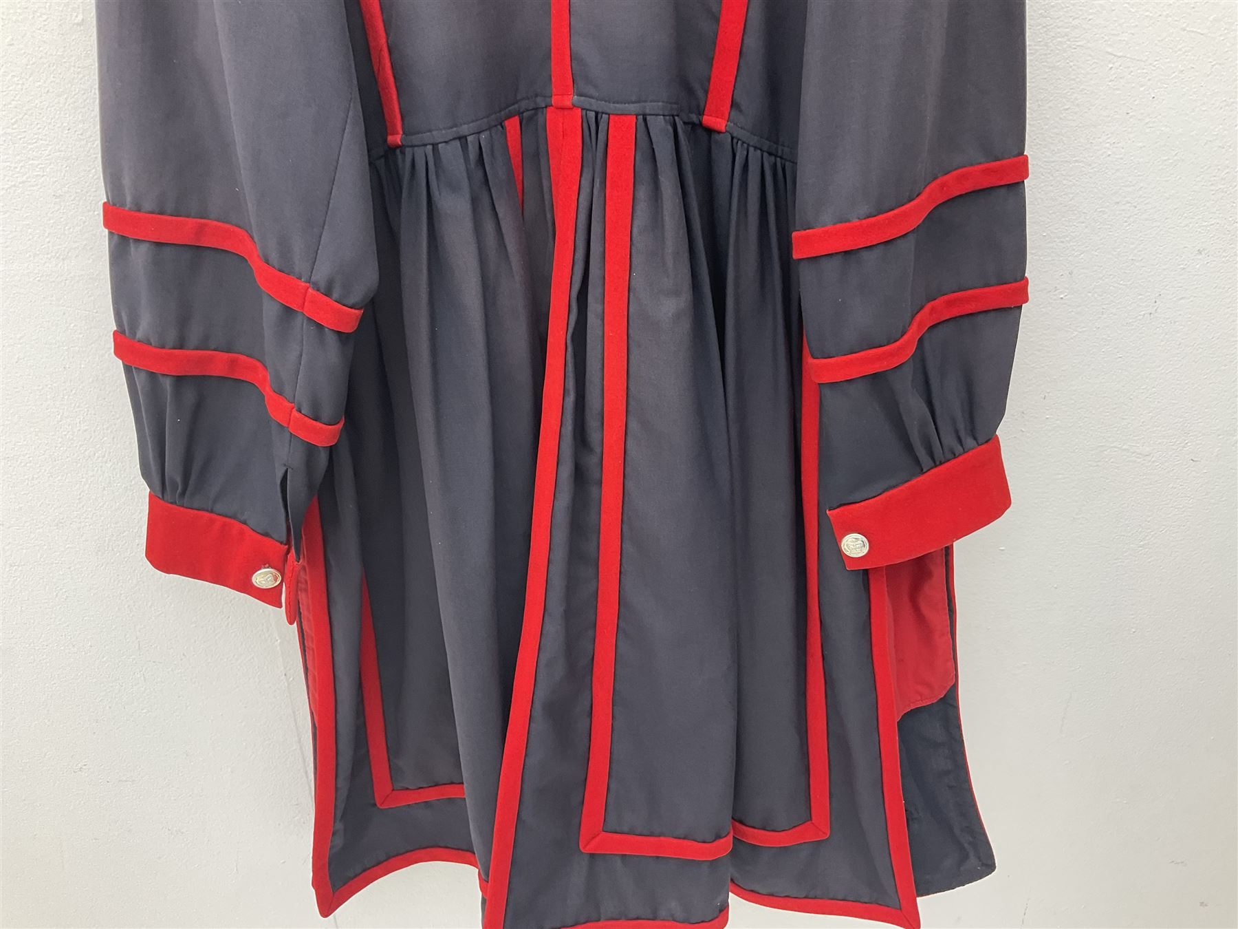 Elizabeth II Yeoman Warders (Beefeater) No.1 Undress blue uniform - comprising tunic bearing label Crown Military Uniforms H.M. Tower of London and bonnet by S. Patey (2) 