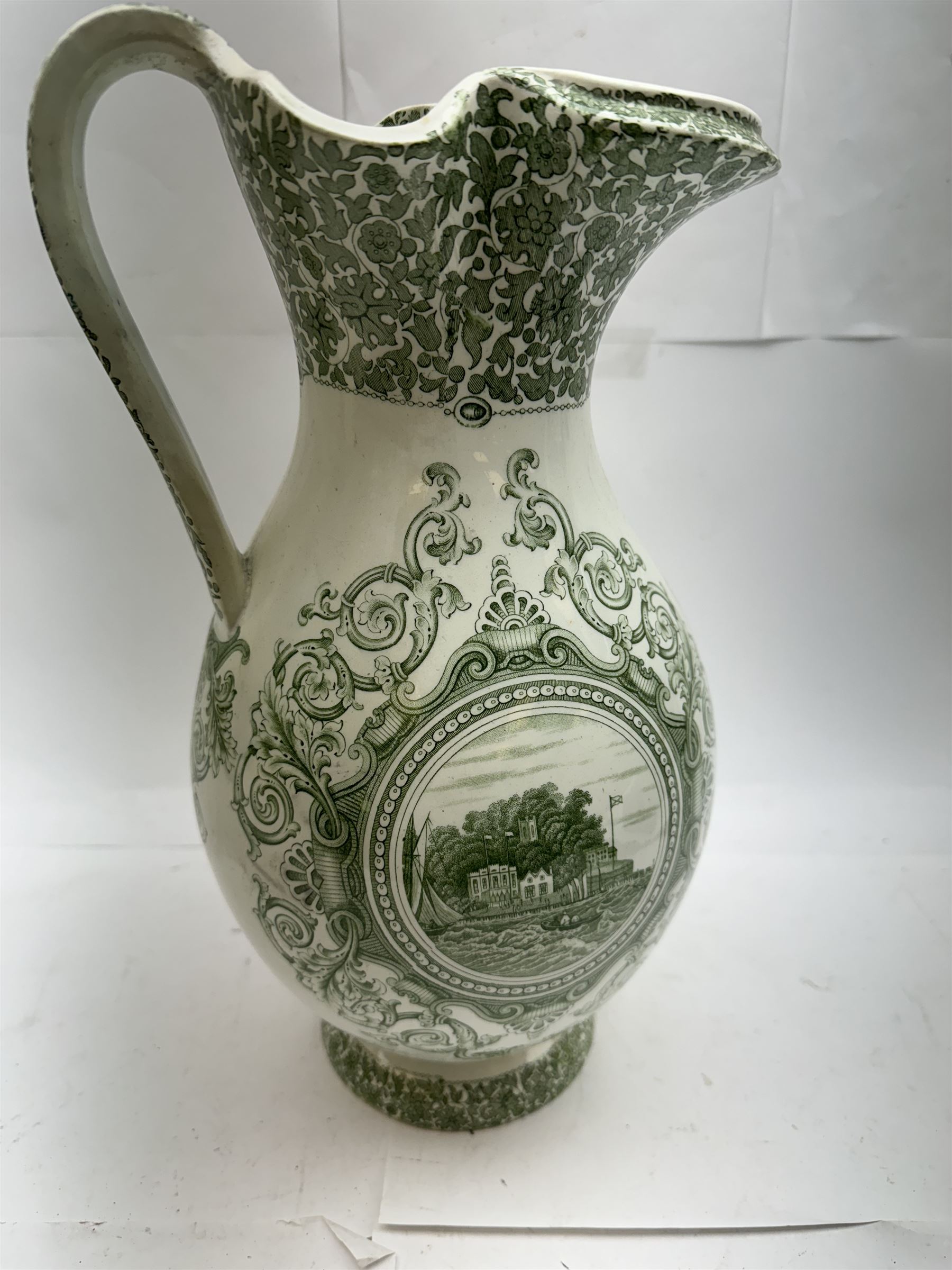 19th century Copeland & Garrett New Blanche wash jug, with green transfer printed decoration of 'West Cowes', H36cm, together with a treacle glaze pottery puzzle jug, H28cm