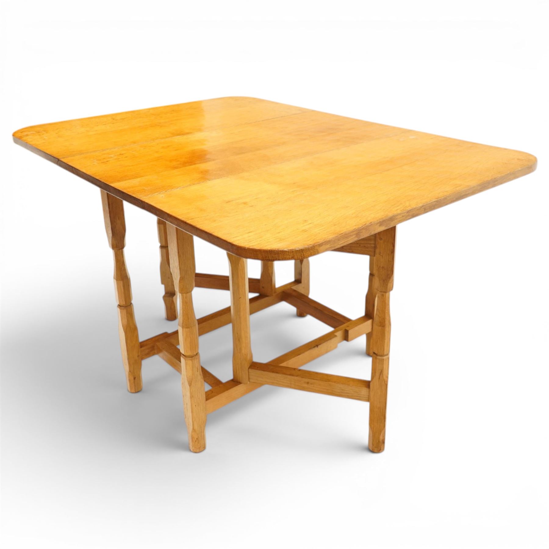 Beaverman - 1980s adzed oak drop-leaf dining table with gate-leg action, adzed top and leaves extending to 129cm, octagonal supports with large Beaver carving, by Colin Almack of Sutton near Thirsk 