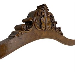 Victorian beech and birdseye maple veneered shaped wall mirror, the pediment carved with foliate C-scrolls and central leaf motif, bevelled glass plate 