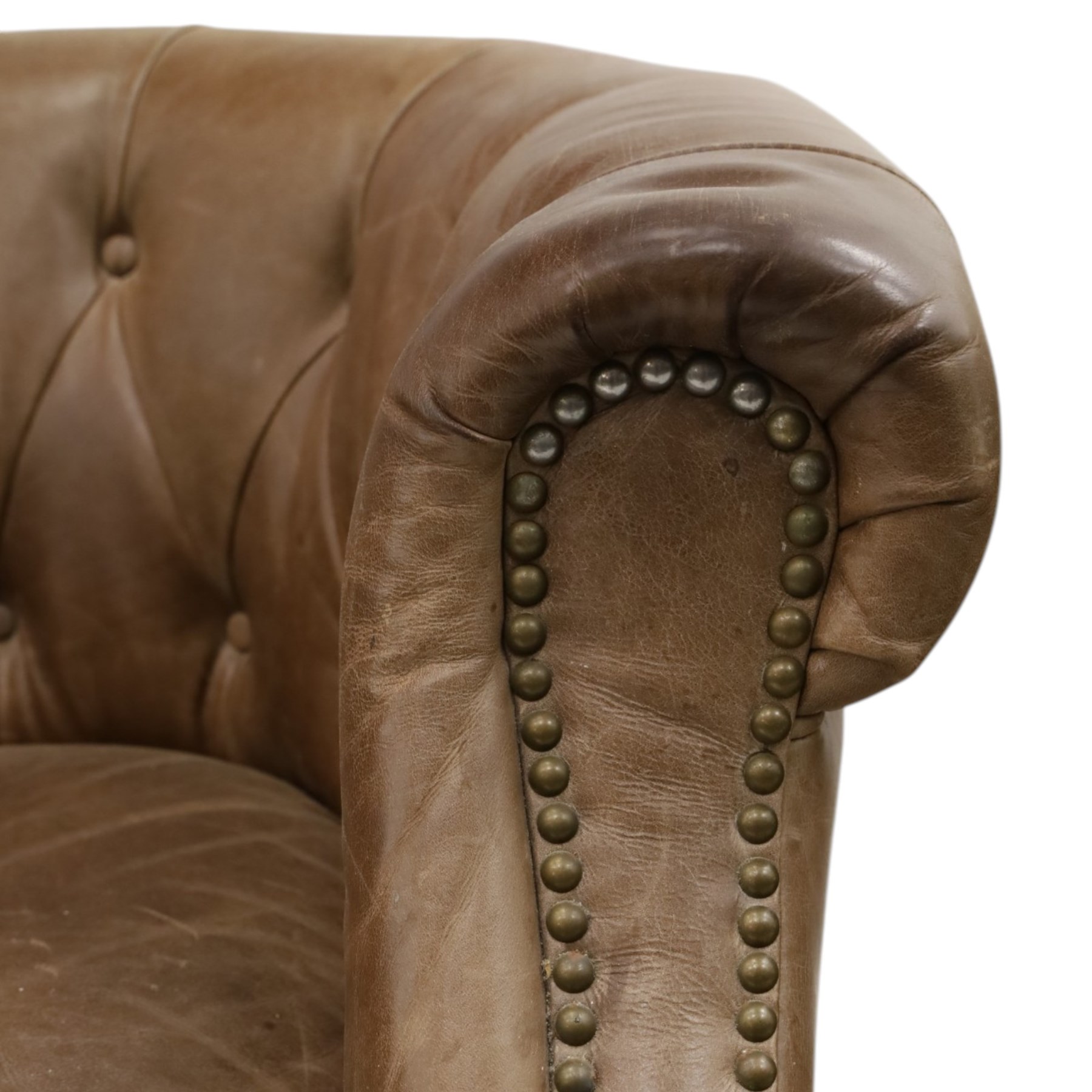 Alexander and James - pair of 'Jude' tub armchairs, traditional tub shape with buttoned back over deep seat, with studwork to the arm terminals, raised on turned front supports and splayed rear supports