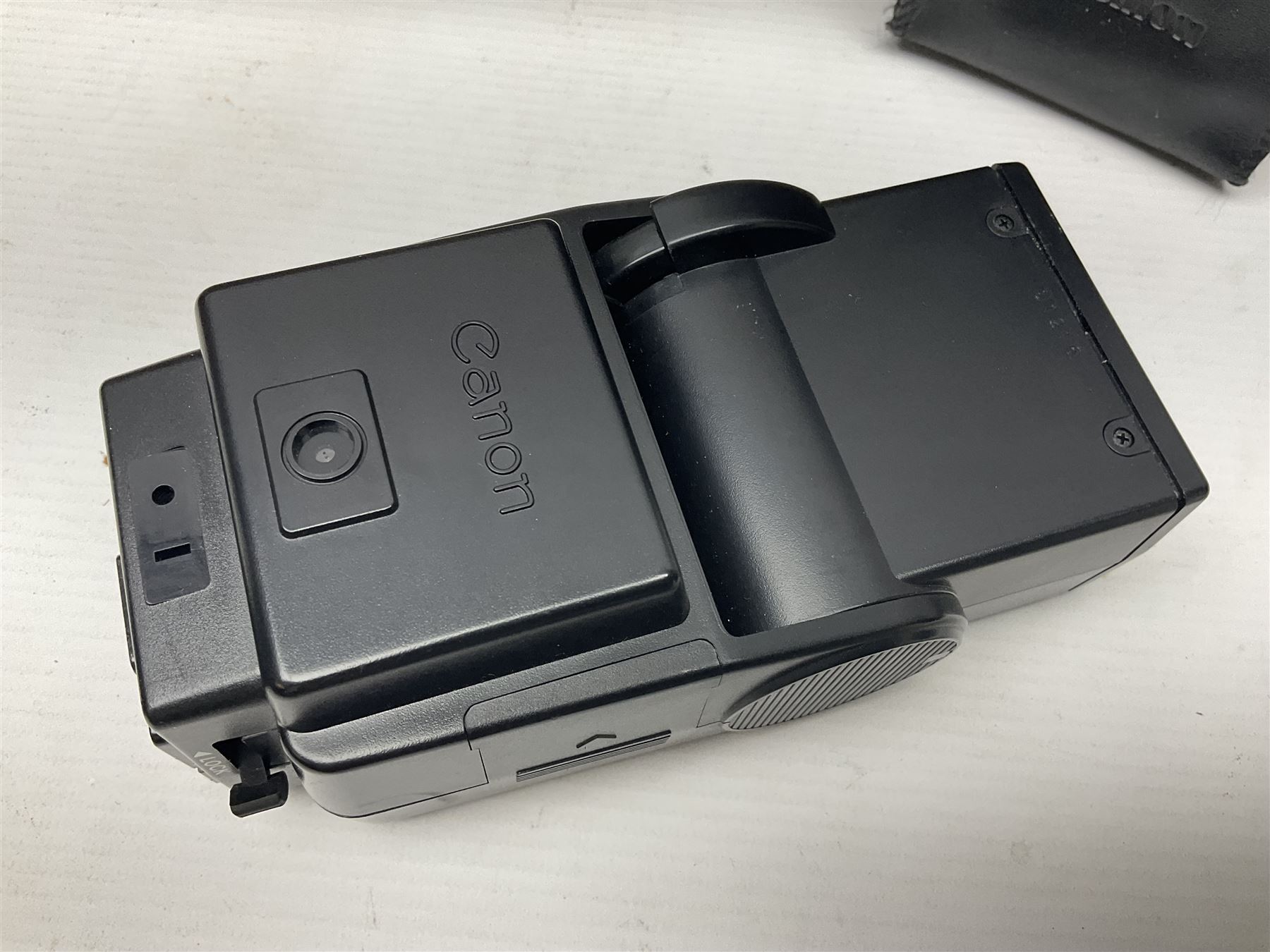 Canon A1 35mm camera body serial no 741264, with 'Tokina AT-X 28-85mm 1:3.5-4.5' lens serial no 821679, 'Canon FD 50mm 1:1.8mm' lens and other camera equipment 