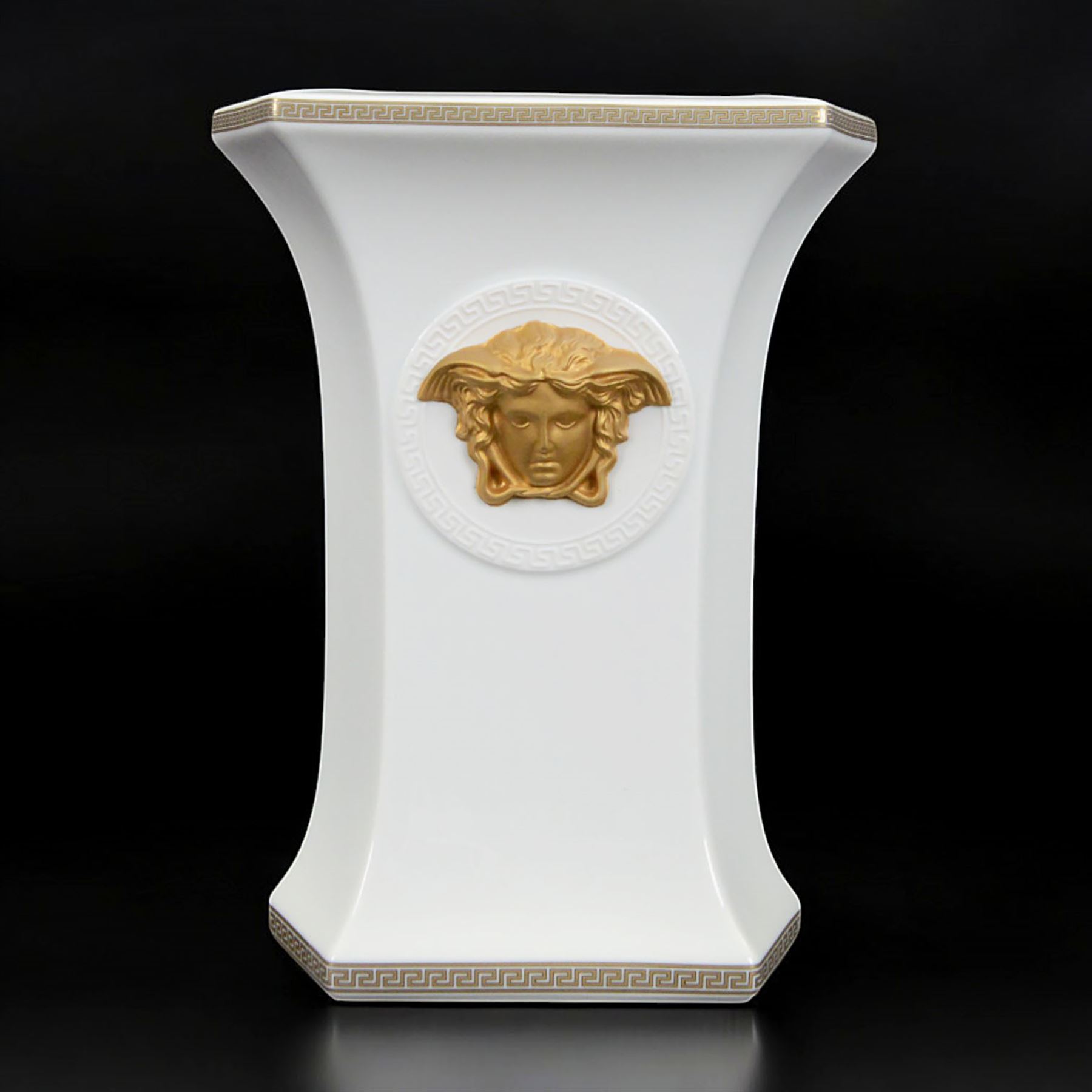 Rosenthal Versace Gorgona vase, of rectagular form with fluted base and rim, decorated in relief with medusa masks and gilt greek key borders upon a white ground, boxed, H23cm