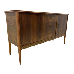 Peter Hayward for Vanson - mid-20th century teak sideboard, rectangular top with rounded corners over three central drawers, flanked by two cupboard doors enclosing shelves, raised on tapered supports