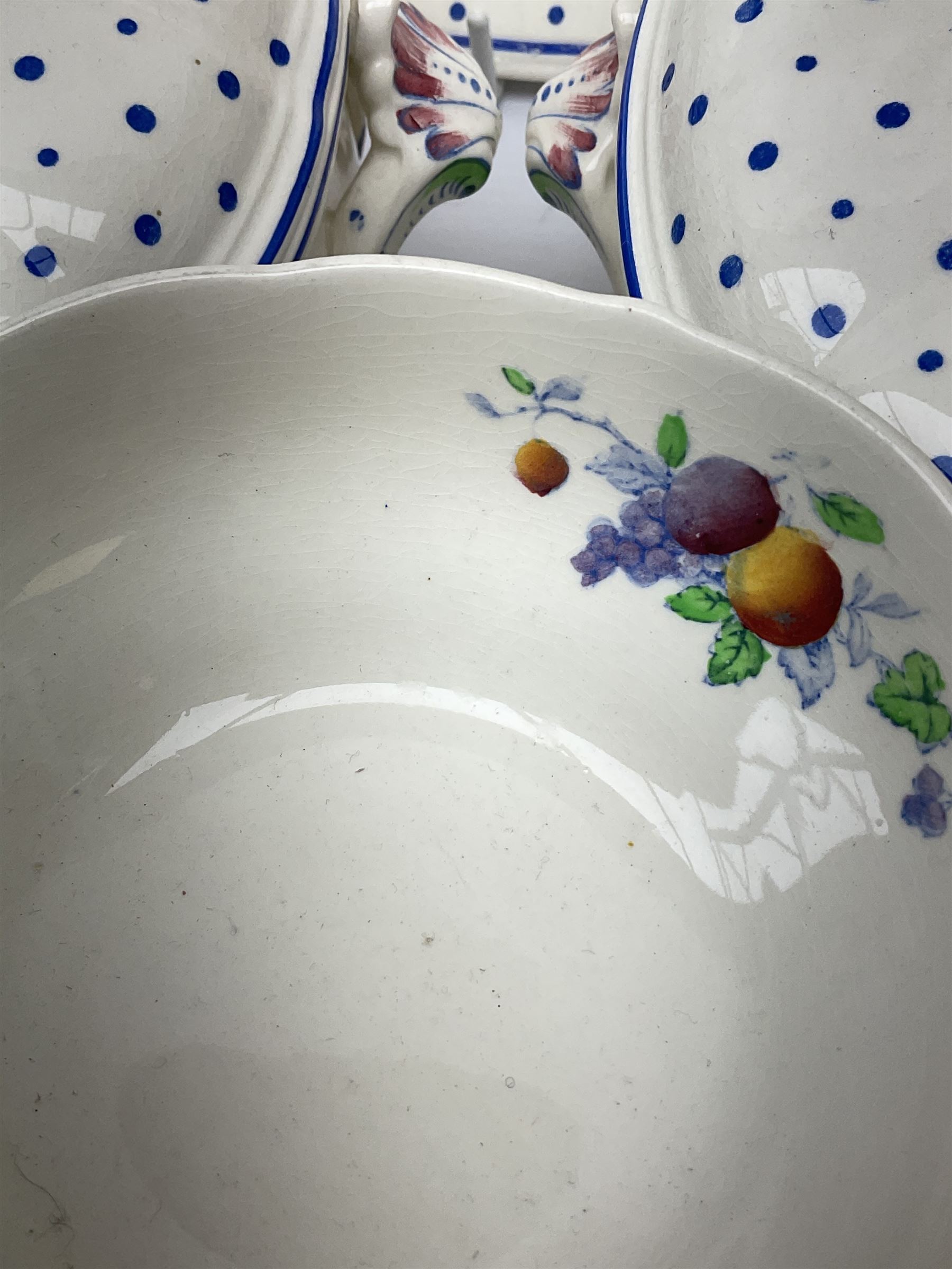 Copeland Spode Polka Dot pattern dinner and tea wares, comprising four dinner plates, seven salad plates, four dessert plates, six twin handled soup bowls and two saucers, six chocolate cups with covers and six saucers, two sauce boats, two tureens and covers, and four graduated serving platters. 