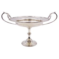 1920's silver twin handled pedestal dish, the shallow circular bowl with twin curved acanthus detailed handles, upon a knopped stem and spreading circular foot, hallmarked Fowler & Polglaze Ltd, London 1926, including handles H15cm D18cm, approximate weight 11.45 ozt (356.2 grams)
