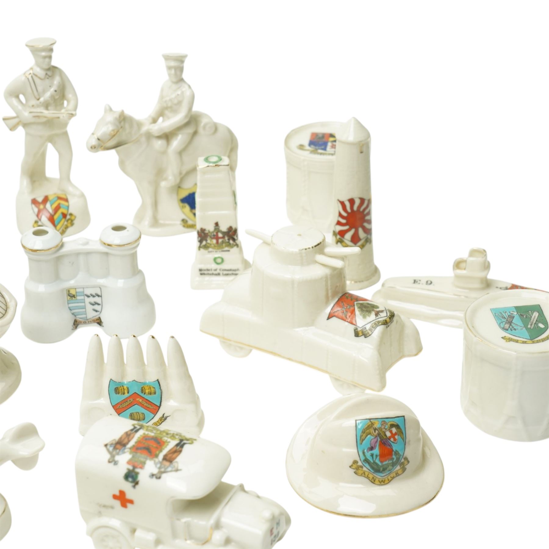 WWI crested china including Arcadian model of British Cavalry Soldier, another 'Tommy in Bayonet Attack', Swan China 'Despatch Rider', Arcadian 'Tommy Atkins', ambulance, E Boat, two tanks, Cenotaph etc