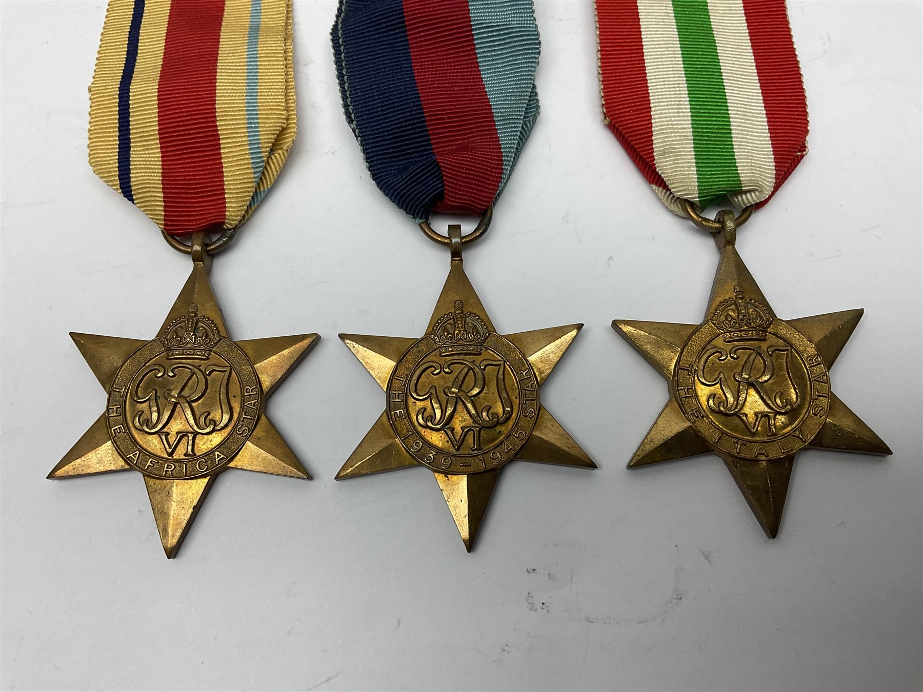 Group of five WWII medals comprising 1939-45 War Medal, Defence Medal and Italy, Africa and 1939-45 Stars; all with ribbons (5)