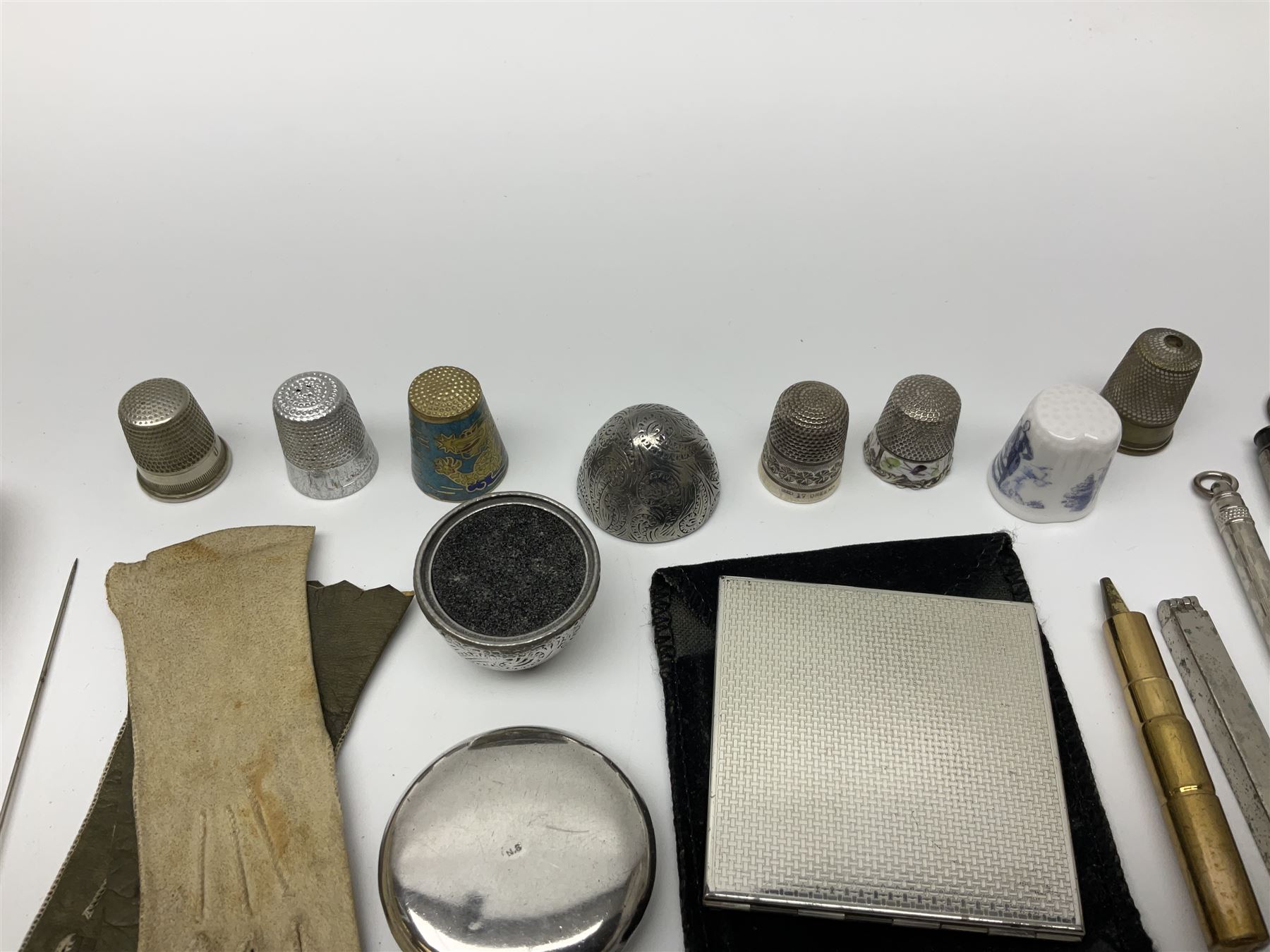 Pair of Wedgewood jasperware unicorn cufflinks, silver handled part manicure set, enamel flip notebook, dolls leather gloves, Stratton compact, and a collection of sewing accessories including thimbles, button hooks, thimble holder, scissors etc 