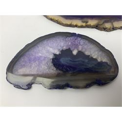 Four purple agate slices of various sizes, polished with rough edges