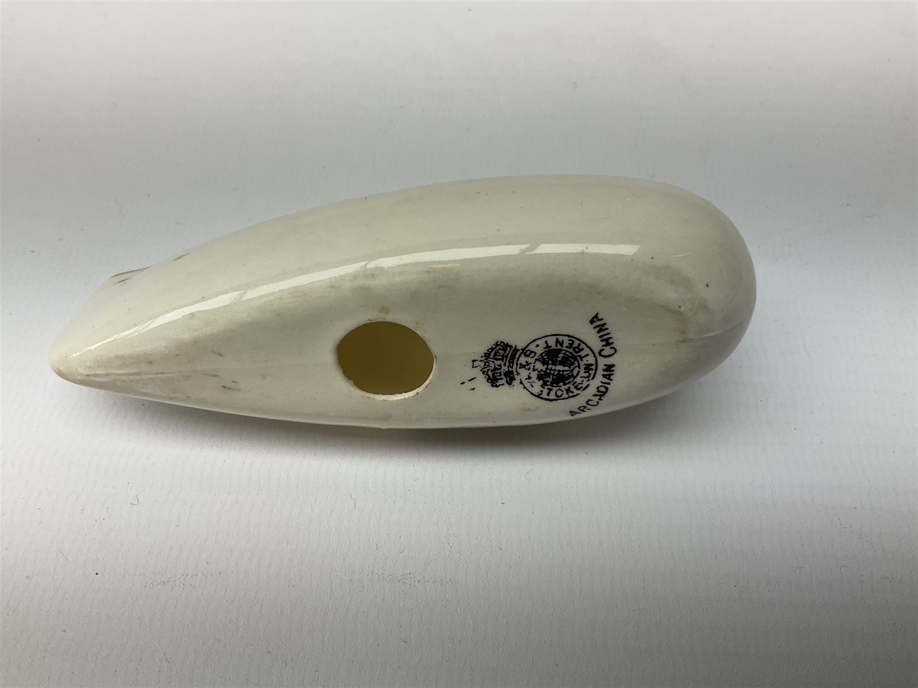 Three pieces of crested ware, comprising grenade detailed 'The Mills Hand Grenade' with Filey Crest, marked beneath Grafton China, a cannon with crest banner detailed 'Sterlini Oppidvm', marked beneath W H Goss, and a submarine with Tunbridge Wells crest, marked beneath Arcadian China 