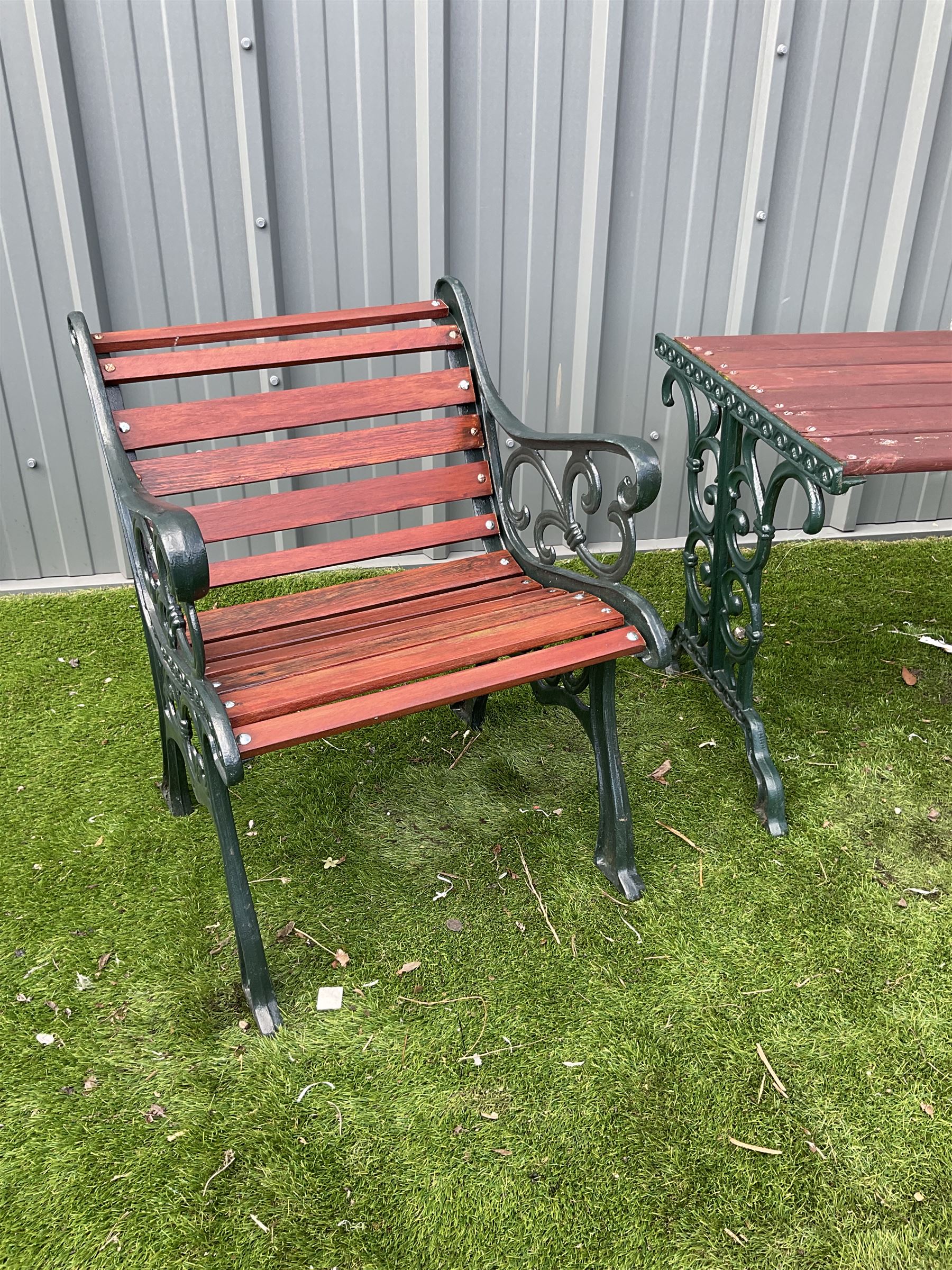 Painted cast iron and wood slated table and two chairs  - THIS LOT IS TO BE COLLECTED BY APPOINTMENT FROM DUGGLEBY STORAGE, GREAT HILL, EASTFIELD, SCARBOROUGH, YO11 3TX