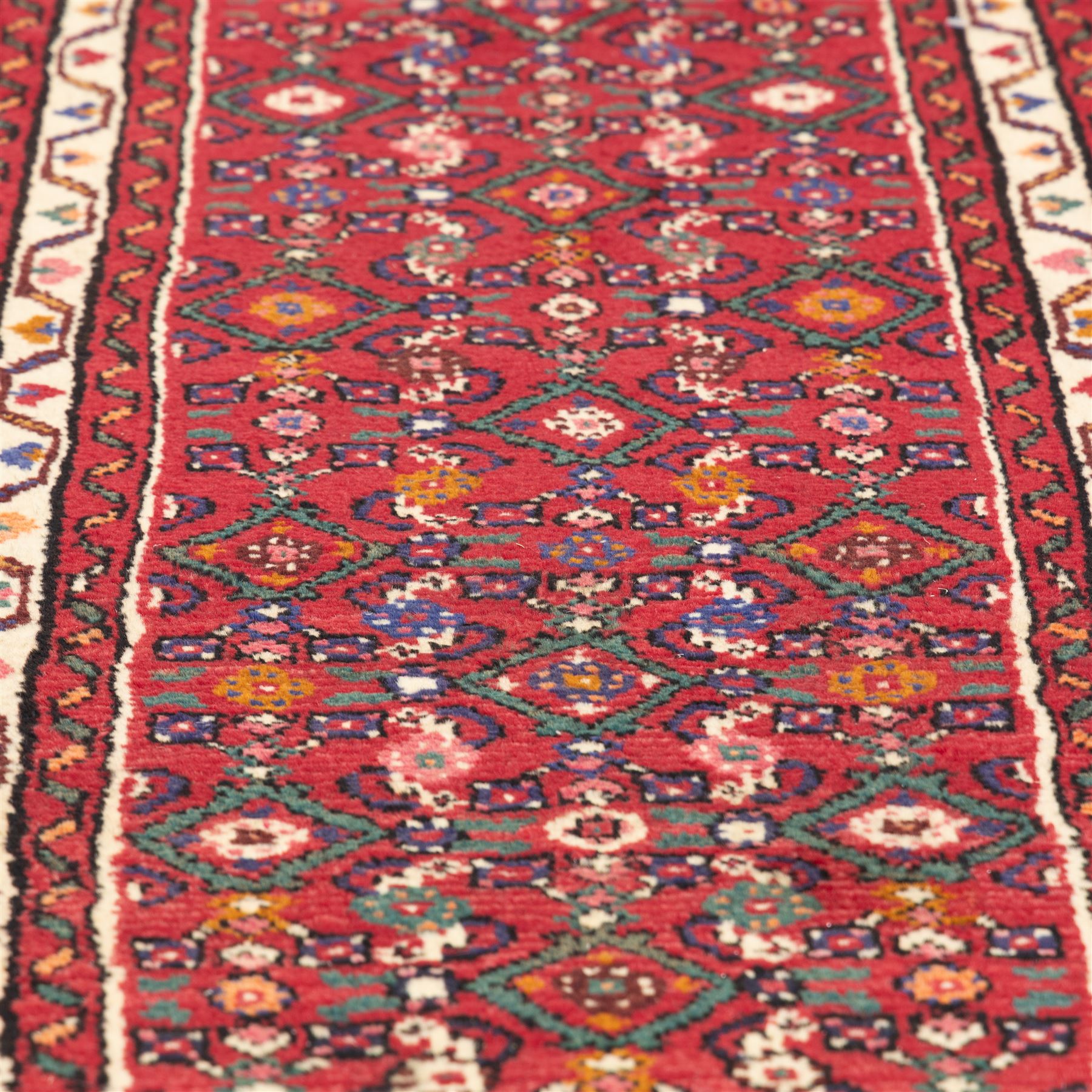 North west Persian hand-knotted Malayer runner, vibrant rose field with an all-over lattice design of lozenges and stylised floral motifs, ivory spandrels within a zig-zag main border flanked by multiple guard stripes 