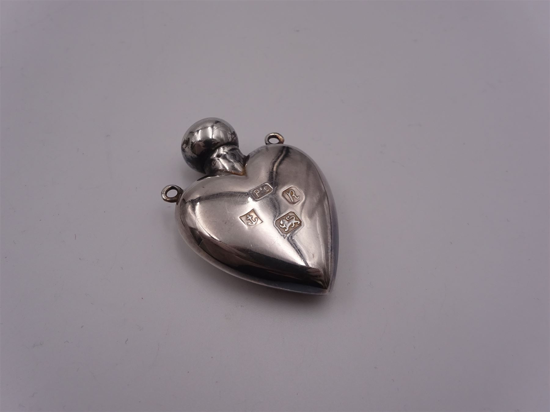 Group of silver flatware, to include Victorian christening set comprising knife, fork and spoon with silver handles, blade, prongs, and bowl, hallmarked Martin, Hall & Co, Sheffield 1868, William IV Fiddle pattern dessert fork, hallmarked William Eaton, London 1834, two Victorian teaspoons, 1920's teaspoons, and three Continental graduated spoons and set of matching sugar tongs with rose and vine detail, stamped 825, etc., together with a a small modern silver pendant modelled in the form of a heart, hallmarked Penhaligon's, Birmingham 1991, and two modern silver page markers, each stamped 925, one example worn import mark, approximate total weight 8.61 ozt (267.8 grams)