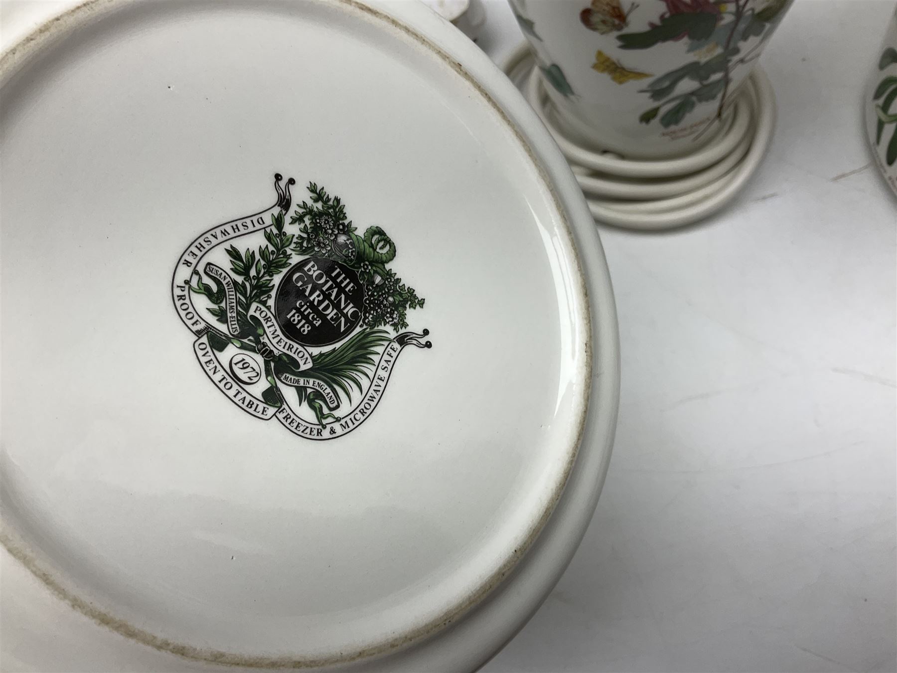 Two Portmeirion Botanic Garden table lamps, together with two Portmeirion Botanic Garden planters