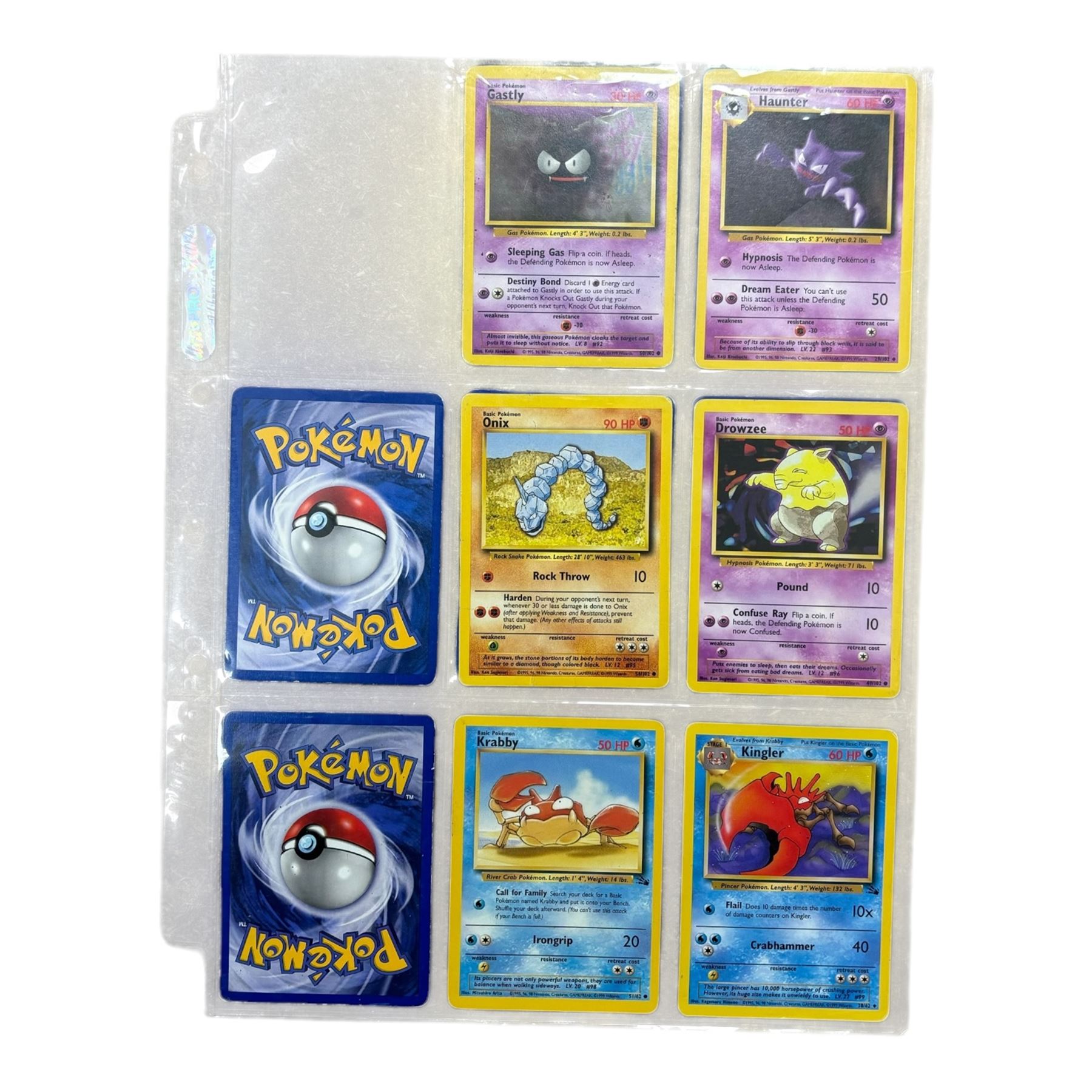 Collection of mainly vintage Pokemon cards including Charizard Base Set Holographic number 4/102 and two Ancient Mew 2000 promo cards, some housed within plastic wallets and some loose