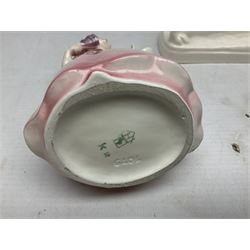 Early 20th century Katzhütte figure of a pointer dog, and figure of a young girl holding basket and fan, both with green cat H house printed mark beneath, dog L25cm