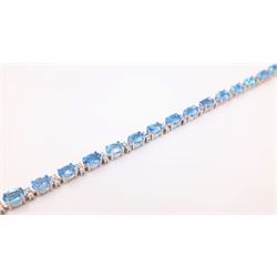  18ct white gold blue topaz and round brilliant cut diamond bracelet stamped 750 diamonds approx 0.8 carat topaz approx 12 carat  