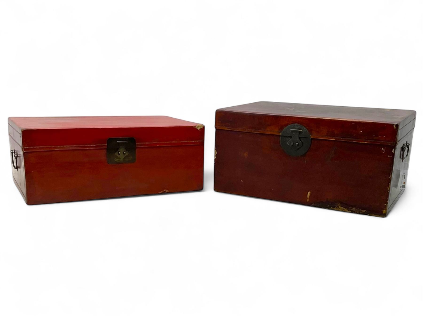 Pair of Chinese 18th century hand-painted leather-bound wooden trunks, each adorned with metal locks, twin carrying handles and patterned fabric-lined interior