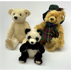 Three modern Steiff teddy bears comprising limited edition white with growler mechanism No.523/5000 H32cm; limited edition blond dressed as a Scotsman with tartan hat and scarf no.2019/3000; and seated panda (3)