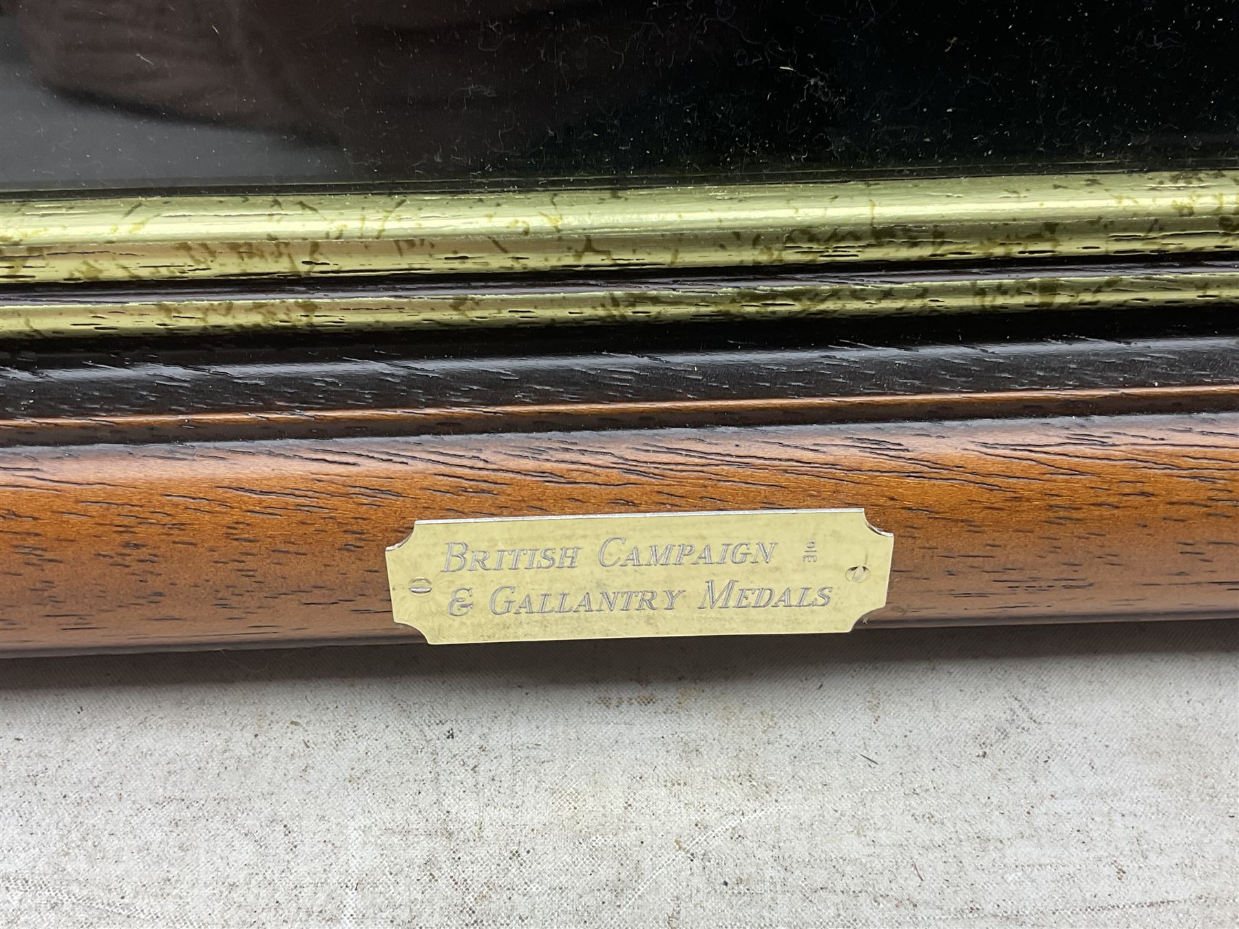 Limited edition large framed display board with sixty half-size copies of British Gallantry and Campaign Medals produced by Danbury Mint; all with ribbons and associated booklet