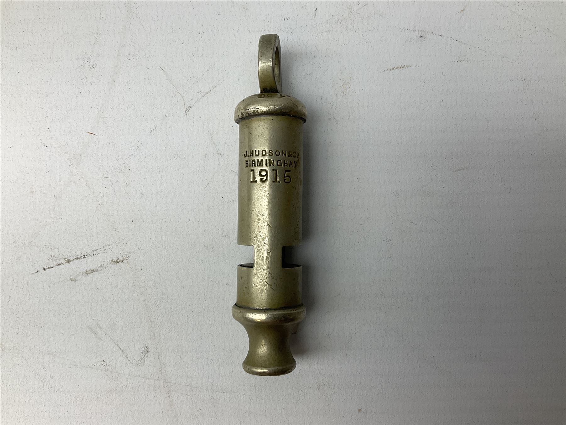 Three J Hudson & Co Birmingham military whistles, dated 1915, 1916, 1923