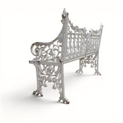 Victorian revival heavy cast iron garden bench, ornate back rest with scrolls, floral motifs and central crest, pierced lattice seat, curved arms and decorative legs, painted in antique white, in the Gothic Coalbrookdale style - Damaged 