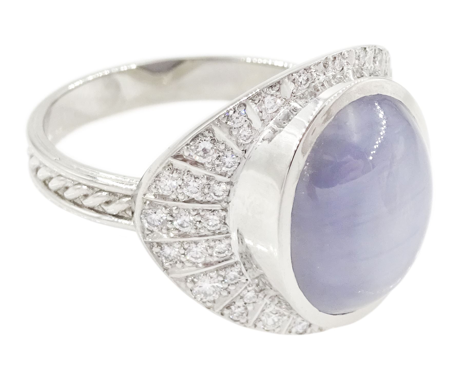 Platinum star sapphire and diamond ring by Scarab London, single cabochon cut sapphire of approx 8.17 carat, with sunburst design surround set with round brilliant cut diamonds, to a plaited design shank, London 2024, total diamond weight approx 0.50 carat, with Alan Poultney Gems report