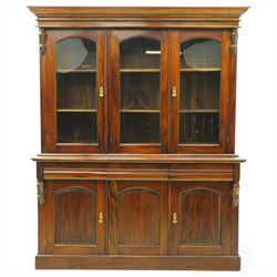 Victorian revival hardwood dresser cabinet, projecting moulded cornice above three glazed doors with shaped tops enclosing shelves, moulded top over three drawers and three panelled cupboard doors, flanked by applied carved brackets, on plinth base