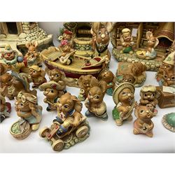 Extensive collection of Pendelfin rabbits and stands, to include Betsy Barge, Fruit Shop, Uncle Soames, Event Piece etc, many with original boxes 