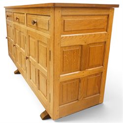 Beaverman - 1980s adzed oak sideboard raised on a trestle base, three drawers over three cupboards with Yorkshire Rose carved handles, fielded panelled sides and front, with carved Beaver, by Colin Almack of Sutton near Thirsk